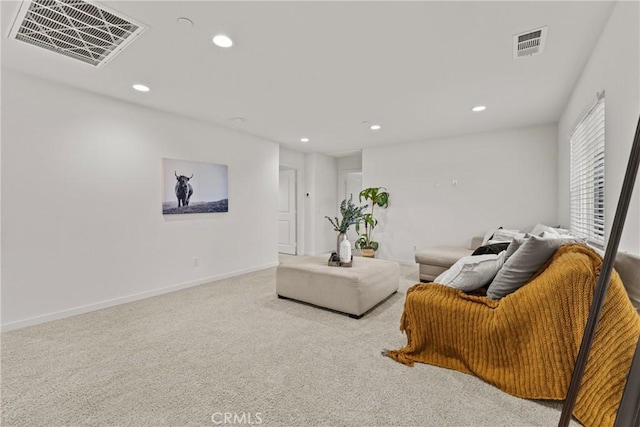 living area with carpet flooring, recessed lighting, visible vents, and baseboards