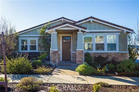 craftsman house featuring stone siding and board and batten siding