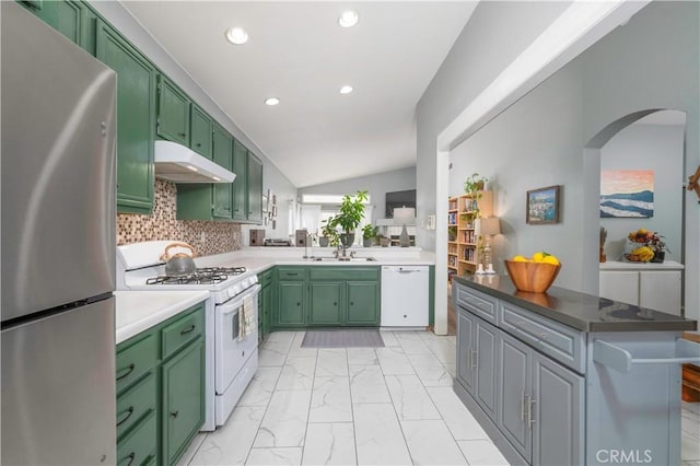 kitchen featuring under cabinet range hood, white appliances, and green cabinets