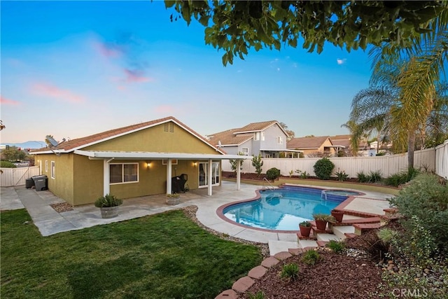 view of pool featuring a patio, a yard, a fenced backyard, and a fenced in pool