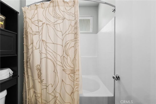 full bathroom featuring shower / bath combination with curtain