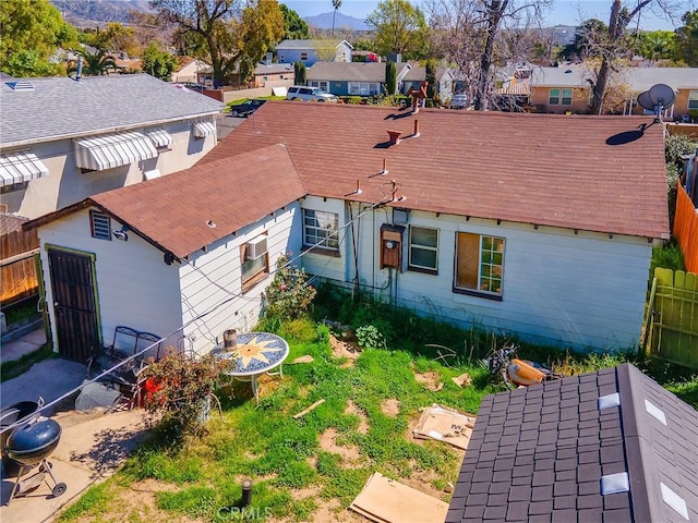 drone / aerial view featuring a residential view and a mountain view