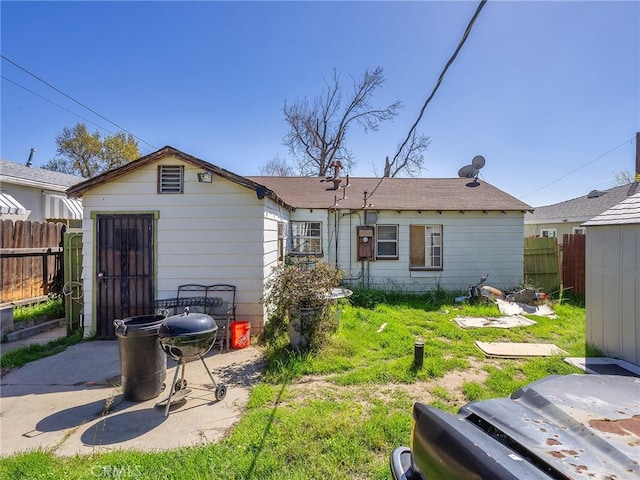 back of house with a patio area and fence