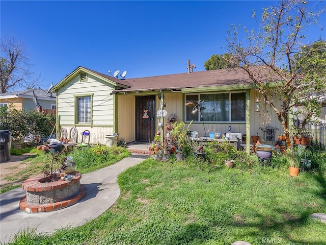 ranch-style house with a front yard