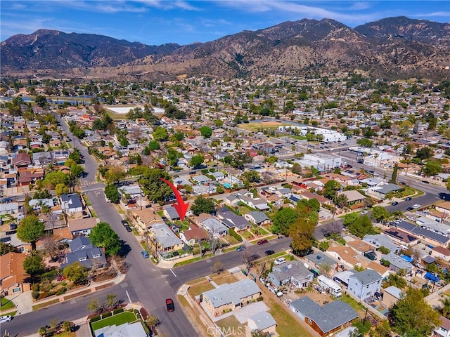 drone / aerial view with a mountain view and a residential view