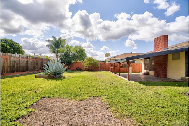 view of yard featuring a patio and a fenced backyard