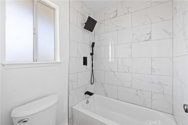 bathroom with toilet and  shower combination