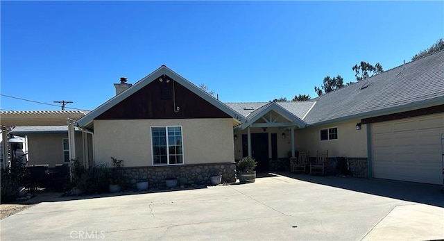 ranch-style house featuring stucco siding, stone siding, a chimney, and a pergola