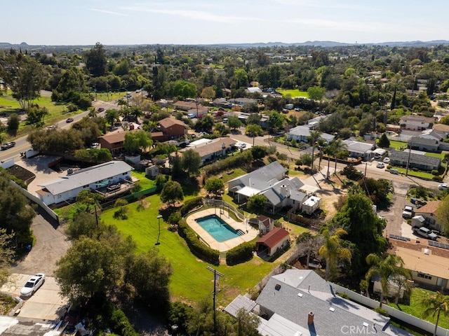birds eye view of property with a residential view