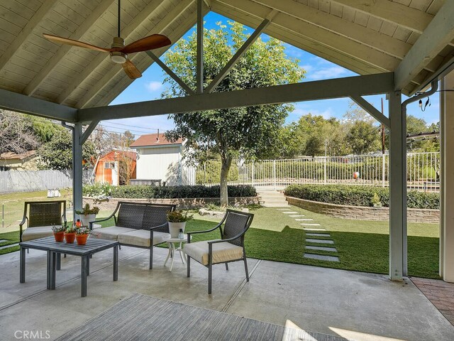 view of patio / terrace featuring an outdoor structure, a fenced backyard, a storage unit, a ceiling fan, and outdoor lounge area