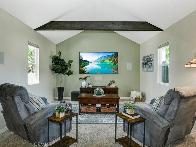 living room with vaulted ceiling with beams and baseboards
