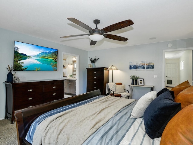 bedroom featuring ensuite bathroom, ceiling fan, and light colored carpet