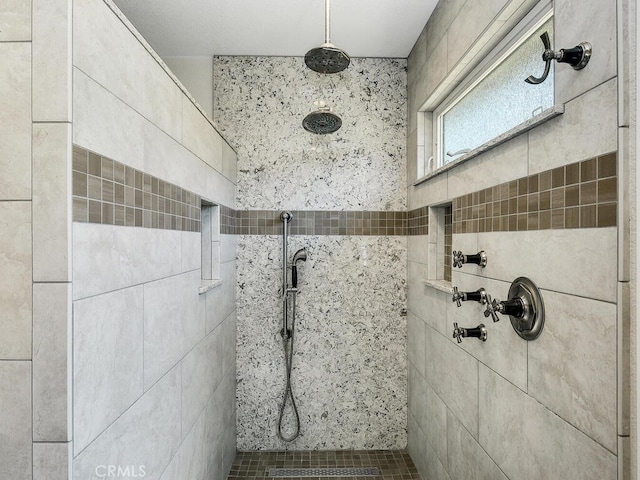 bathroom featuring a tile shower