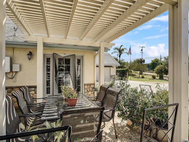view of patio / terrace featuring outdoor dining space and a pergola