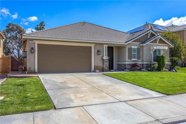 view of front of property featuring a front yard, driveway, an attached garage, stucco siding, and a tile roof