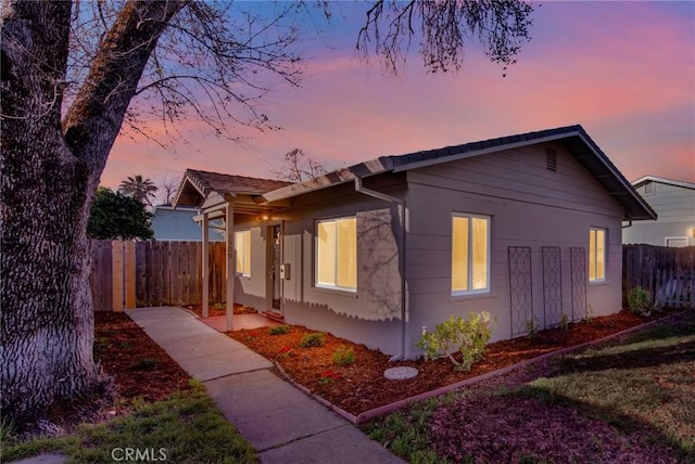 view of front of home with fence