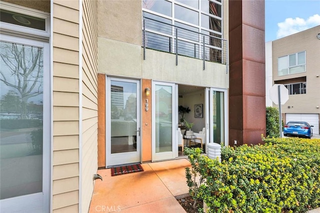 view of exterior entry featuring a garage