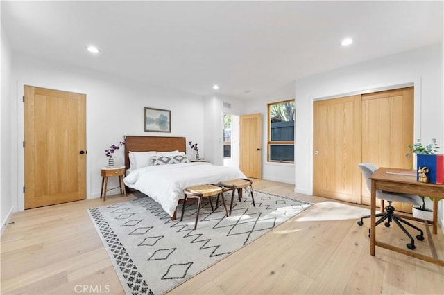 bedroom featuring recessed lighting, wood finished floors, and baseboards