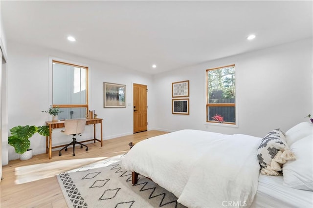 bedroom featuring recessed lighting, baseboards, and light wood-style flooring