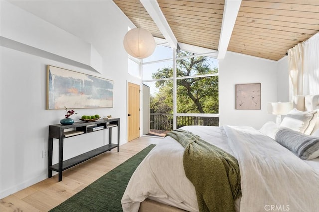 bedroom featuring beam ceiling, high vaulted ceiling, wood finished floors, baseboards, and wood ceiling