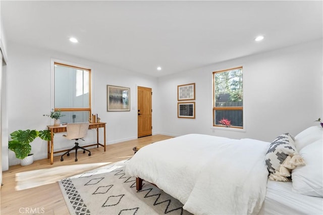 bedroom with recessed lighting, baseboards, and light wood finished floors