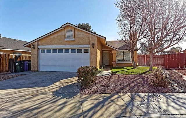 ranch-style house featuring stucco siding, concrete driveway, a garage, and fence