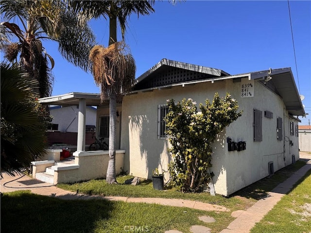 view of home's exterior with stucco siding