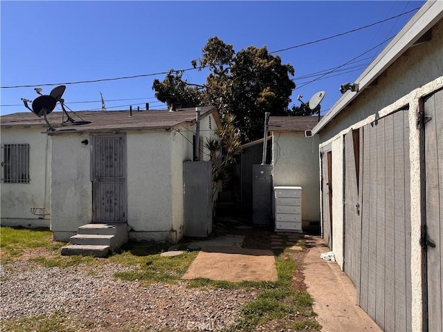 exterior space featuring stucco siding