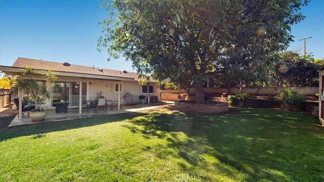 view of yard featuring a patio and fence