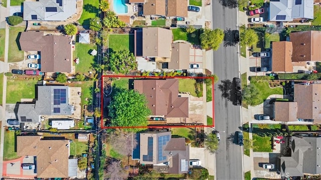 birds eye view of property with a residential view