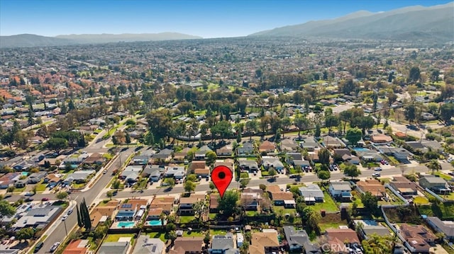 birds eye view of property featuring a mountain view and a residential view