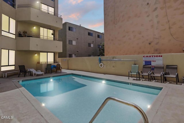 pool with a patio area