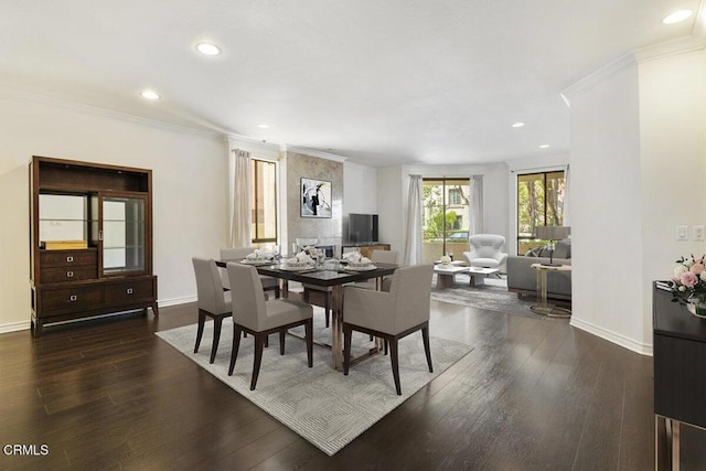 dining space featuring recessed lighting, baseboards, dark wood finished floors, and crown molding