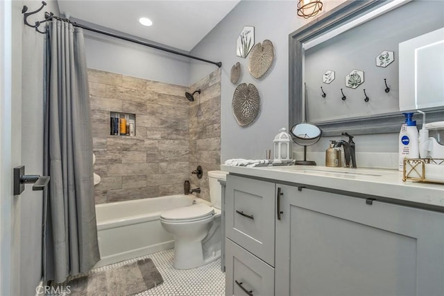 full bath featuring vanity, tile patterned floors, toilet, and shower / bathtub combination with curtain