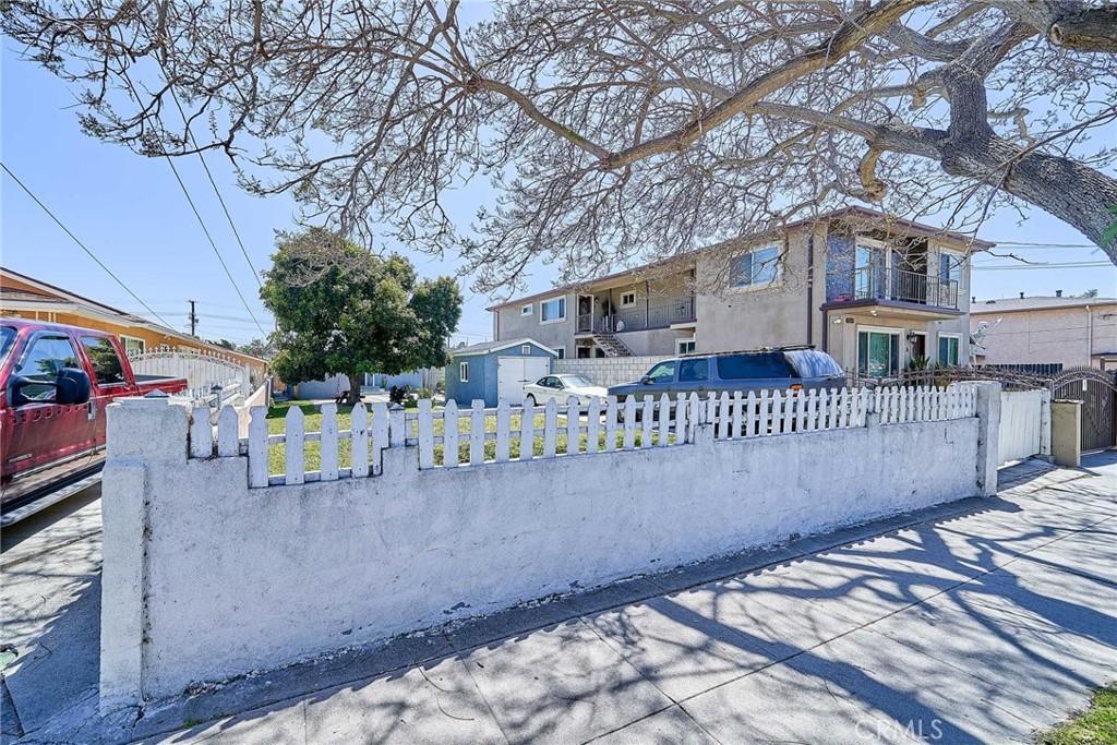exterior space featuring a fenced front yard and a balcony