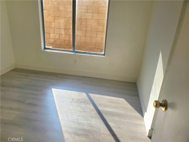 empty room featuring baseboards