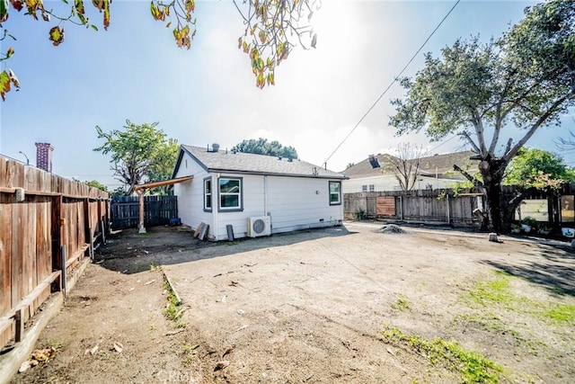 back of house featuring ac unit and a fenced backyard