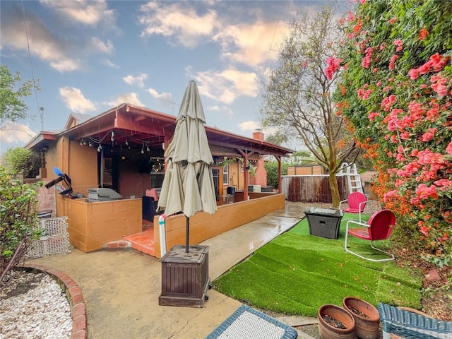 exterior space with a patio and fence