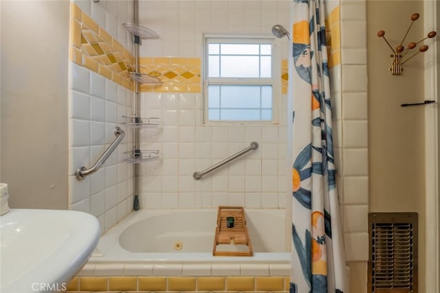 full bathroom featuring tiled shower / bath