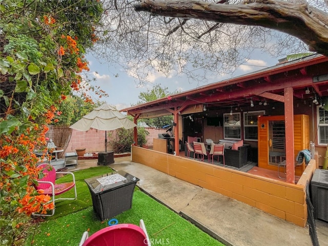 view of patio / terrace with an outdoor living space and fence private yard