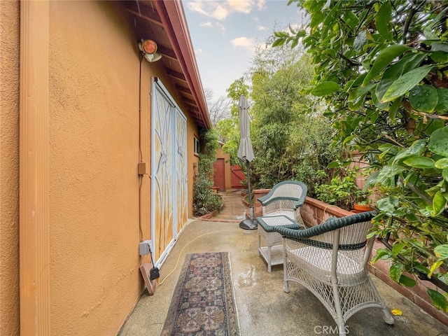 view of patio / terrace featuring fence