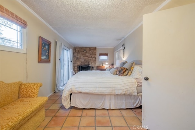 bedroom featuring a textured ceiling, multiple windows, light tile patterned flooring, and ornamental molding