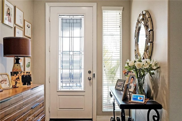 doorway to outside featuring a wealth of natural light