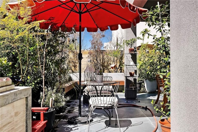 view of patio featuring outdoor dining area