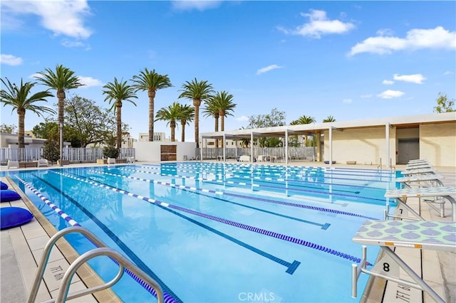 community pool featuring fence