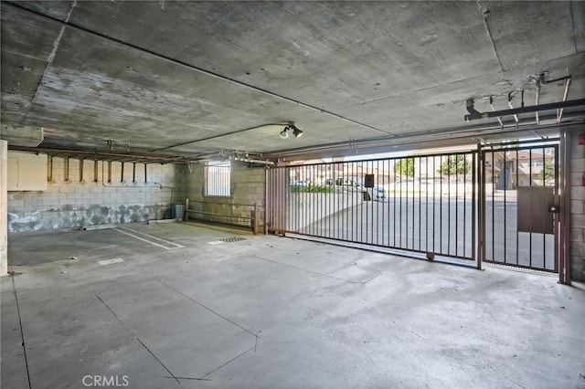 garage with concrete block wall