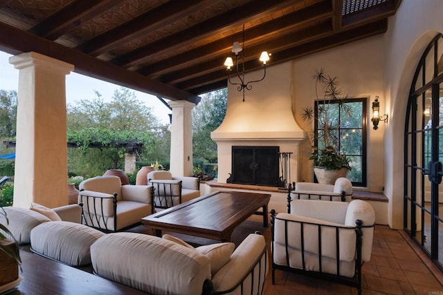 view of patio / terrace featuring an outdoor living space with a fireplace