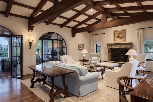 living room with beam ceiling, high vaulted ceiling, wood finished floors, and a premium fireplace