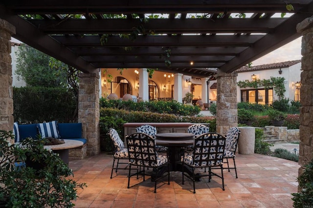 view of patio / terrace featuring outdoor dining space and a pergola