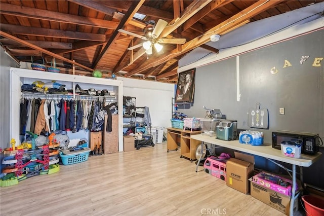 below grade area featuring wood ceiling, ceiling fan, and wood finished floors